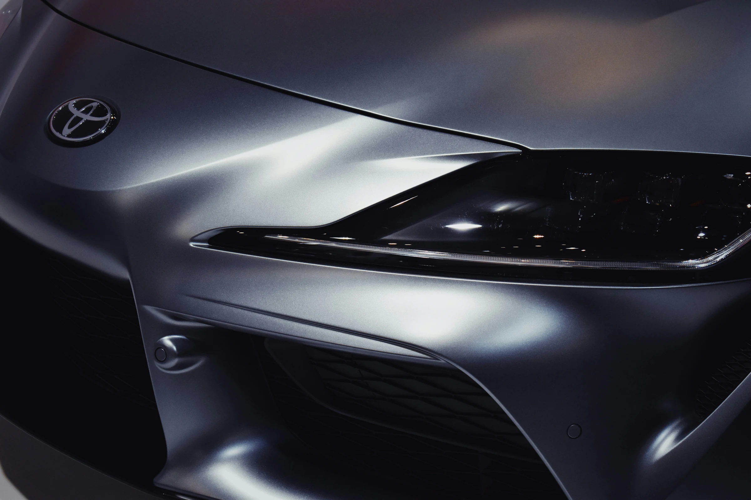 Close-up of the front wing and headlight of a Toyota Supra